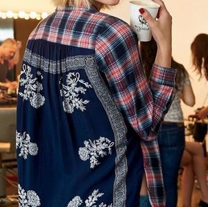 Free people behind the flannel button down